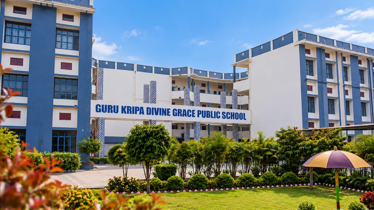 Guru Kripa Divine Grace Public School campus in Bahraich, with landscaped grounds in front of the school blocks